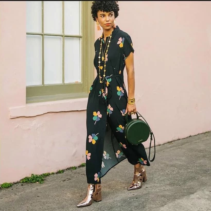 A model in a botanical jumpsuit outside on the avenue