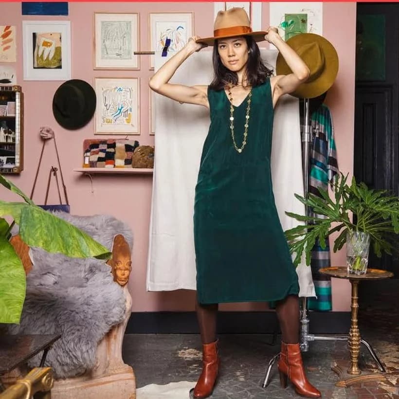 A vintage emerald slip dress styled with western boots